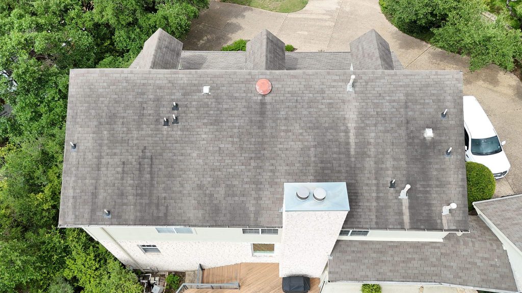 Overhead view of the worn original roof and the pipe and exhaust penetrations where leaks were found, Lost Creek, Austin 78746